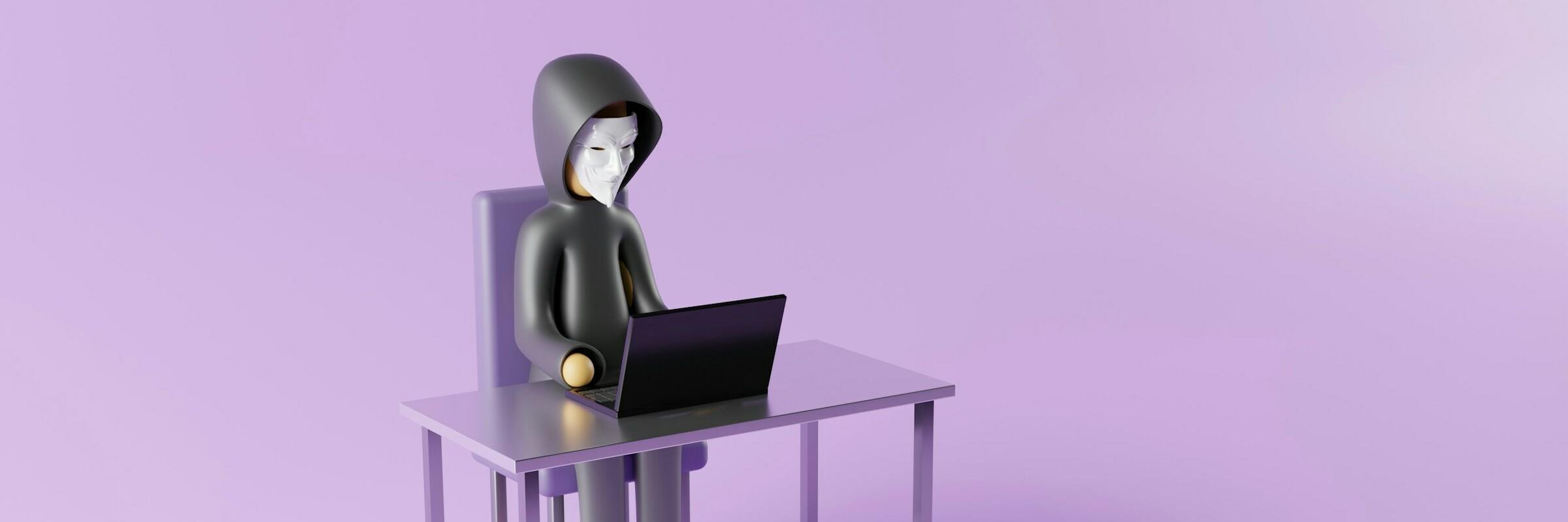 Person mit Maske am Laptop Figur mit Anonymus-Maske sitzt an einem Computer